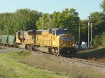 UP 4018 leads a loaded rock train across Door Creek Road